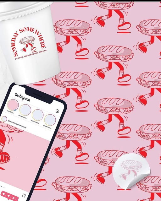 The café’s walking sandwich mascot repeated in red across soft pink packaging.