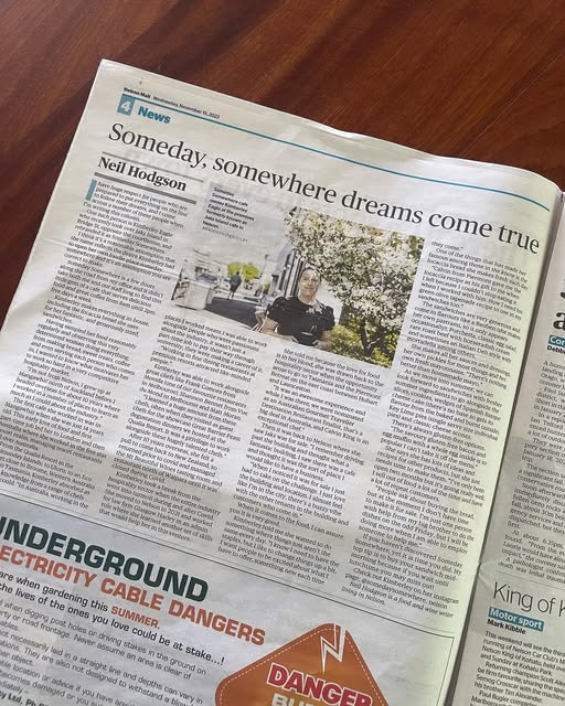 A local newspaper page with the headline “Someday, somewhere dreams come true”.